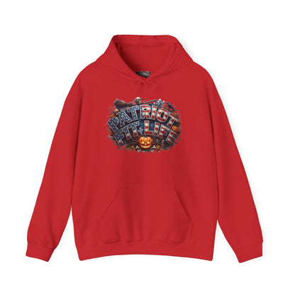 A red pullover hoodie with a front Halloween graphic that reads 'PATRIOT FIT LIFE' in a stylized, multi-colored font, featuring a jack-o'-lantern. The hoodie is shown against a plain white background.