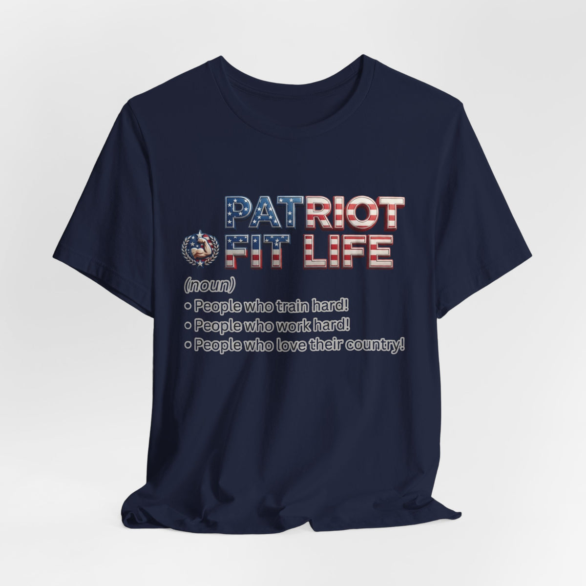 A navy blue short-sleeve t-shirt with a patriotic graphic on the chest reading 'PATRIOT FIT LIFE' in red, white, and blue lettering, with a small circular emblem and a list of definitions below, shown against a white background.