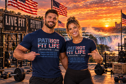 A man and a woman posing in a gym setting at sunset, both wearing matching navy blue t-shirts with 'PATRIOT FIT LIFE' printed on the front. The background features an outdoor workout area with weight equipment, American flags, and a scenic Niagara Falls at sunset.