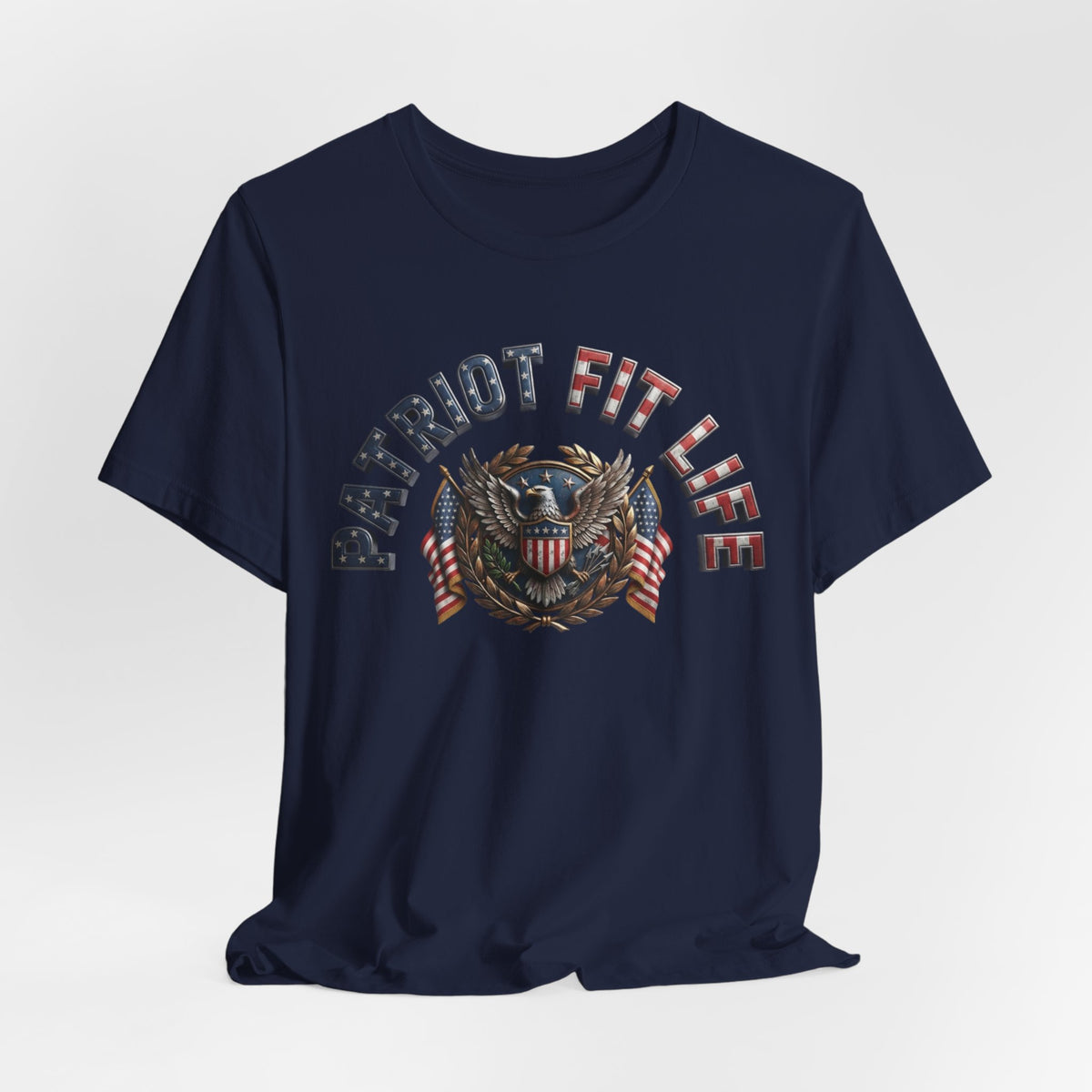 A navy blue short-sleeve crewneck t-shirt featuring a patriotic graphic on the chest with the text 'PATRIOT FIT LIFE' and an eagle emblem with American flag details, shown against a light gray background.