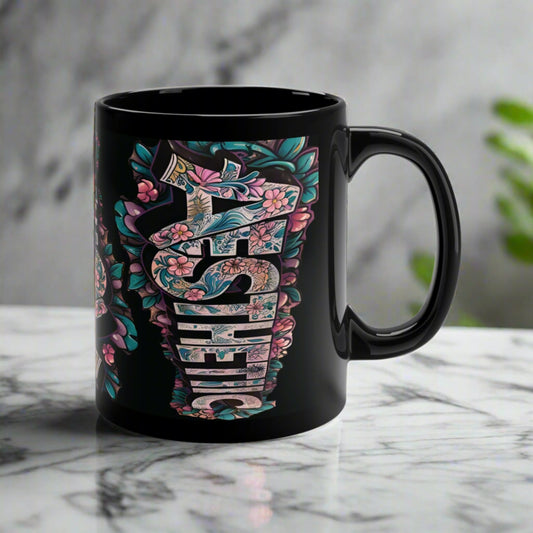 Black floral ceramic coffee mug with a colorful floral print design.