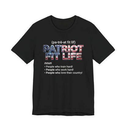 A black short-sleeve t-shirt with a graphic print on the front. The graphic features the  '(pa-tré-ot fit lif)' above the words 'PATRIOT FIT LIFE' filled with an American flag pattern, followed by a dictionary definition of 'noun' with bullet points.