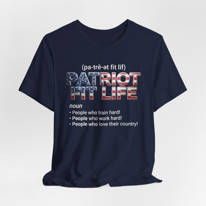 A navy blue short-sleeve t-shirt with a graphic print on the front. The graphic features the text '(pa-tré-ot fit lif)' above 'PATRIOT FIT LIFE' in a red, white, and blue American flag pattern, followed by a dictionary definition below.