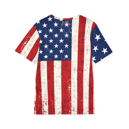 A short-sleeve crewneck t-shirt pictured from behind featuring a distressed American flag print with red and white vertical stripes and a blue field with white stars, shown against a plain white background.