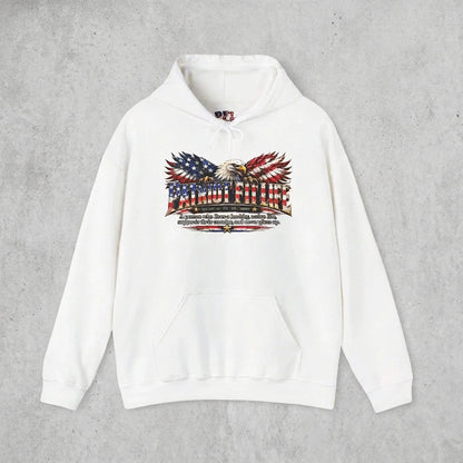 A white pullover hoodie featuring a patriotic graphic on the chest with an eagle, American flag elements, and Patriot Fit Life dictionary-style definition text, displayed against a clean solid white background.