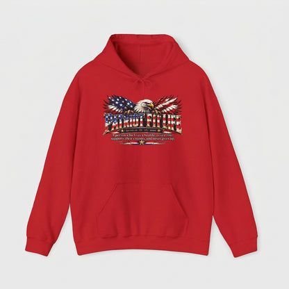 A red pullover hoodie with a patriotic graphic on the chest featuring an eagle with American flag-patterned wings, American flags, and PATRIOT FIT LIFE stylized lettering, with a dictionary-style definition shown against a plain white background.