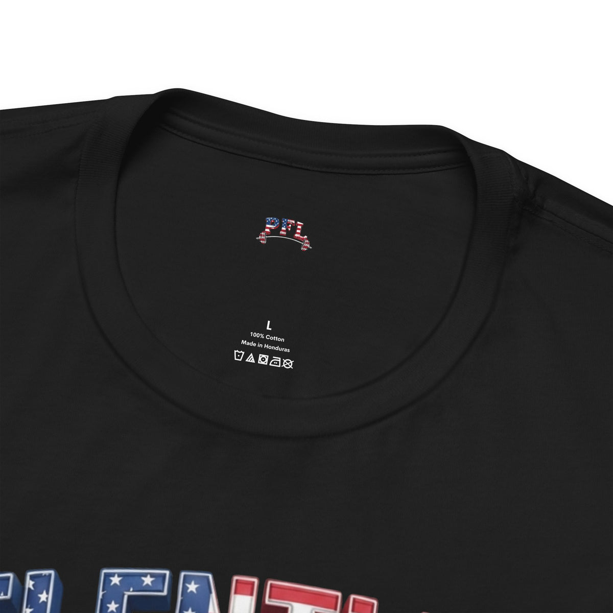 Close-up of a black crewneck t-shirt showing the inner neck label with 'PFL' (Patriot Fit Life) branding and a patriotic graphic design at the bottom.