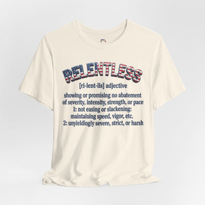 An off-white short-sleeve t-shirt with a graphic print on the front. The graphic features the word 'RELENTLESS' in a red, white, and blue patterned font, followed by a dictionary definition in dark blue text.