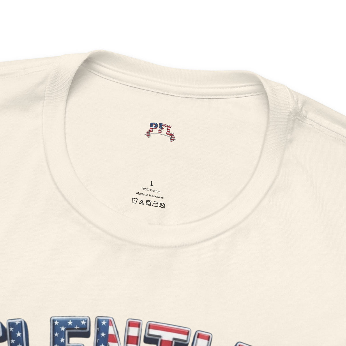 Close-up of an off-white crewneck t-shirt showing the inner neck label PFL with a small red, white, and blue graphic, and part of a patriotic graphic print at the bottom.