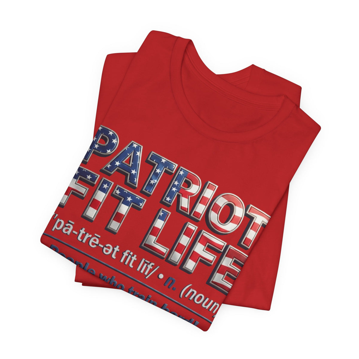 A folded red t-shirt with a patriotic graphic reading 'PATRIOT FIT LIFE' in red, white, and blue with star details, on a plain white background.