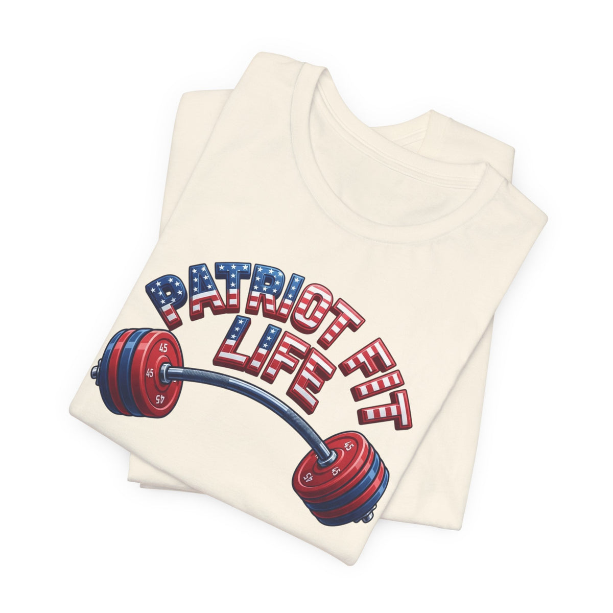 A folded cream-colored t-shirt featuring a graphic of a barbell with red and blue weight plates and the text 'PATRIOT FIT LIFE' in an American flag pattern, set against a plain white background.