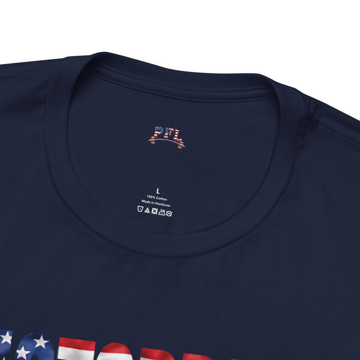 Close-up of a navy blue short-sleeve t-shirt showing the inner collar with a PFL (Patriot Fit Life) logo, a patriotic American flag graphic and size label details.