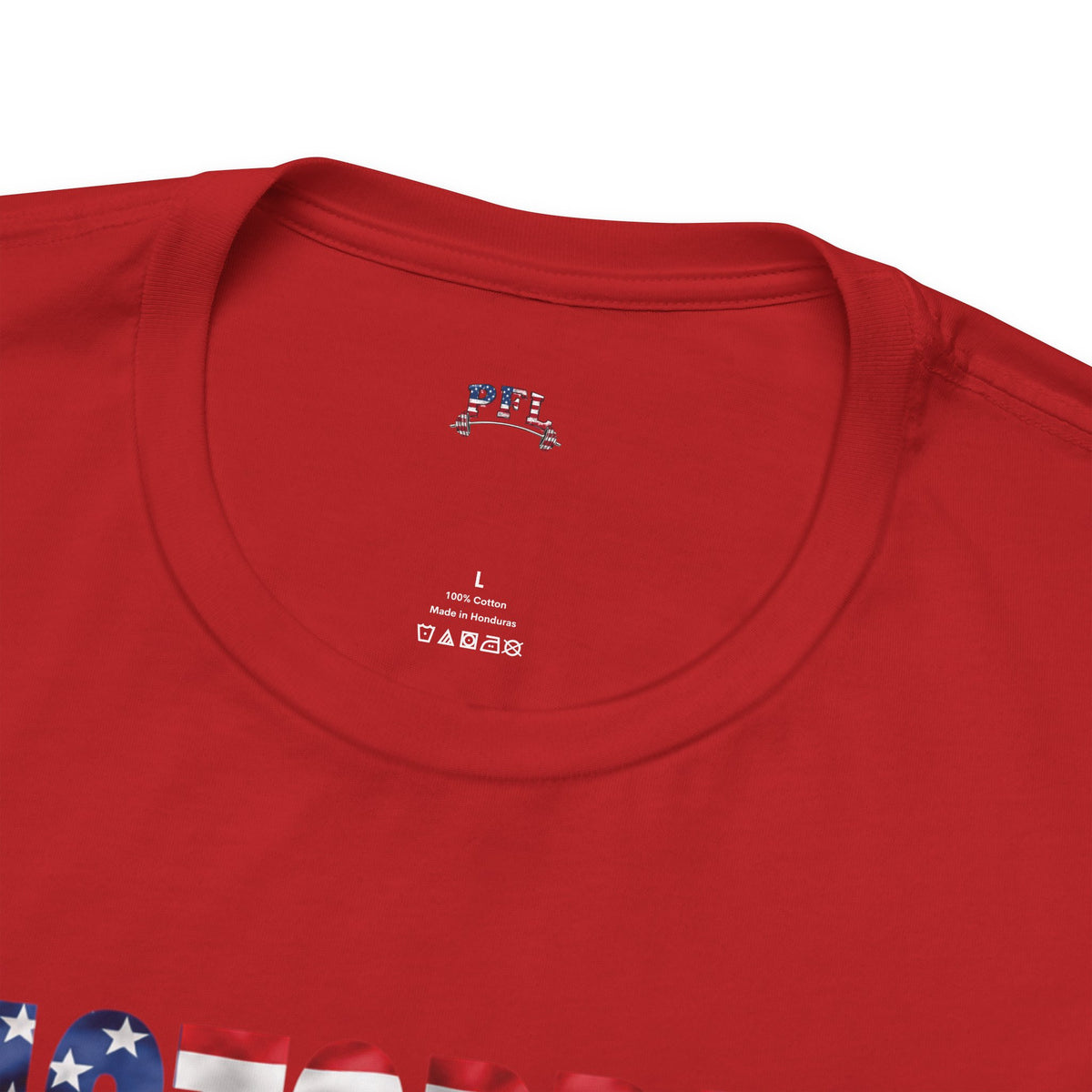 Close-up of a red short-sleeve t-shirt showing the inner neck label PFL logo (Patriot Fit Life) with size 'L' and care instructions, along with a partial patriotic graphic at the bottom edge.