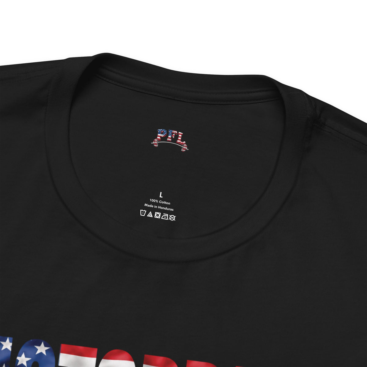 Close-up of a black crewneck t-shirt showing the inner neck label with 'PFL' (Patriot Fit Life) printed in a patriotic American flag design, alongside size 'L' and care instructions.