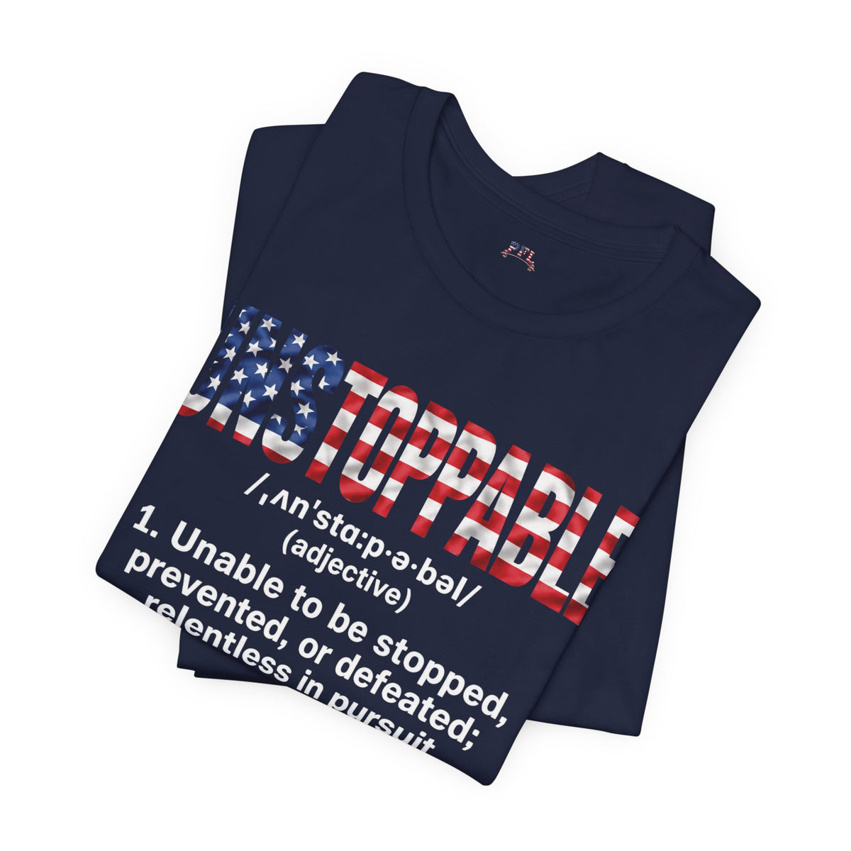A folded navy blue t-shirt featuring a graphic design with the word 'UNSTOPPABLE' styled in an American flag pattern and a dictionary definition printed below in white.
